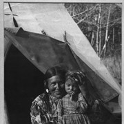 Cover image of Stoney Nakoda mother, Gussie Abraham with child at Kootenay Plains, Gussie was also known as Mrs. Silas Abraham