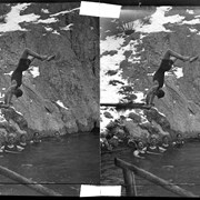 Cover image of Man doing handstand on diving board at Cave and Basin pool