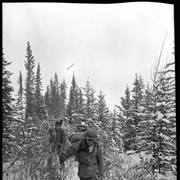 Cover image of Two men bushwacking on winter trapping trip