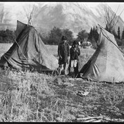 Cover image of [Stoney Nakoda children with playhouse teepee at Kootenay Plains]