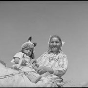 Cover image of Unknown woman and baby on horseback
