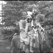 Cover image of 3 unidentified children on horse