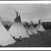 Cover image of [Children and woman sitting in front of tipis in Banff]