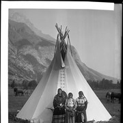 Cover image of [Woman and children standing infront of tipi]