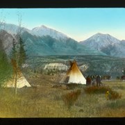 Cover image of "Two tepees [teepees] nestled among the trees"