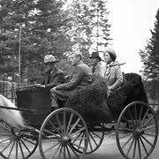 Cover image of Jim Brewster driving King George VI and Queen Elizabeth and Colonel Panet (chief of Canadian Pacific Railway police) in Democrat, 1939