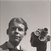 Cover image of Lloyd Harmon and camera. -- 1938 Apr.