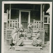 Cover image of "A group on the front porch at camp"