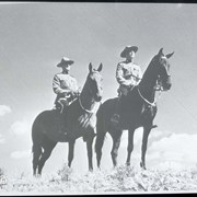 Cover image of 2 mounties, horseback. -- [ca.1940]