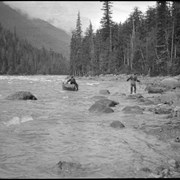 Cover image of Men lining boat on river