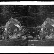 Cover image of Group eating fish in front of tent