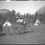 Cover image of Two undidentified people in wagon