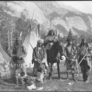 Cover image of John Simeon, Eli Rider, Eli Rider's mother, John Salter (Yarhyerîgen) (Star) and Ben Kaquitts (Mînâ Yuha Wagicha) (Dances with Sword) at Banff Indian Days