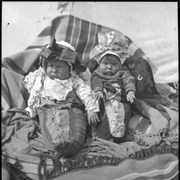 Cover image of Two unidentified babies in traditional outfits