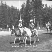 Cover image of Unidentified Indigenous people on horses in Banff Indian Days parade