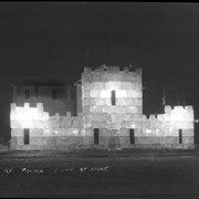 Cover image of Banff Winter Carnival, ice palace at night, Brewster Hall behind