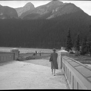 Cover image of [Unidentified men by Trading Post and Lake Louise]