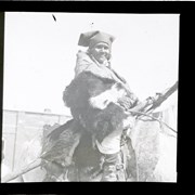 Cover image of Unidentified woman in fur outfit on horse