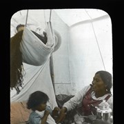 Cover image of Indian tent.  Mackenzie River.  Note coffee percolator