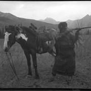 Cover image of Unidentified man with horse and gun