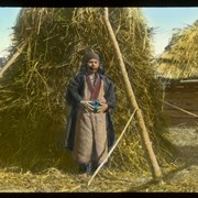 Cover image of [Man in front of haystack]