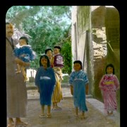 Cover image of [Man, woman and children on road]