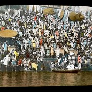 Cover image of 
[Crowd of people along river]