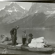 Cover image of [Three people in boat on Maligne Lake]