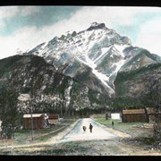 Cover image of [Charles Leroy on Banff Avenue with first milk cow in Banff]