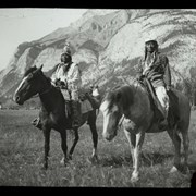 Cover image of [Two unidentified men on horseback at Banff Indian Days camp near Cascade Mountain]