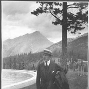 Cover image of Banff, Canada. Captain "Eddie" Rickenbacker by pool, Banff Springs Hotel, Cascade Mountain Background / 27031