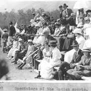 Cover image of Unidentified people sitting on bleachers
