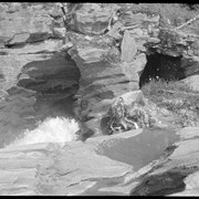 Cover image of Opening to cave, river disappearing. 1905 [file title]