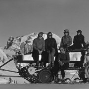 Cover image of Mr. and Mrs. Rod Adams, Mrs. Nicholas Morant, Elizabeth Becker, Mr. and Mrs. Don Hayes on U.S. Army Weasel rebuilt by Brewster Transport and used for carrying people to top of Standish at Sunshine