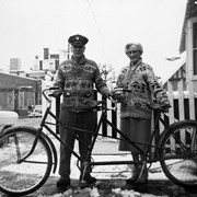 Cover image of George MacKenzie and unidentifed woman with tandem bicycle