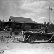 Cover image of Storm Mountain Lodge [Banff-Windermere Highway] Peter Whyte in car, Lucy Kerr in cloak operated Storm Mountain.
