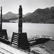 Cover image of Lake Wapta and totem poles. -- 1936 Aug.