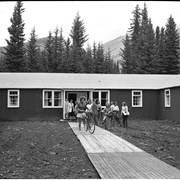 Cover image of Banff School of Fine Arts, Exteriors of Dorms, Girls with Bikes. -- 1946