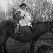 Cover image of [Kathleen, Doris, and Dora posed on horse]