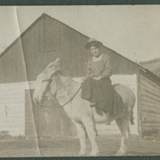 Cover image of "Mother on her thoroughbred"