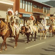 Cover image of (L-R) Tom Kaquitts (Sûga Wakâ) (Dog God), unknown, Charlie Mark or Wilfred Mark (regalia belongs to Wilfred Mark), unknown