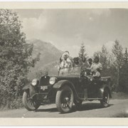 Cover image of The old Hudson - Peter Whyte driving, George McLean (Tatâga Mânî) (Walking Buffalo) with Buffalo horns, Jonas Benjamin, Dan Wildman (Thuda Gado) (Bangs on Steal) (right) on Bow Avenue