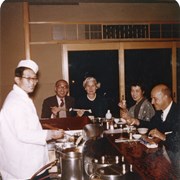 Cover image of Unidentified group having sushi