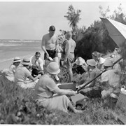 Cover image of [Catharine Whyte, Peter Whyte, Phil Moore on beach with group]