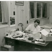 Cover image of [Catharine Whyte seated at desk in home]