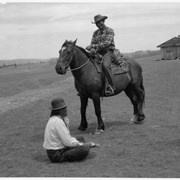 Cover image of [Unidentified man on horse speaking to unidentified seated man]