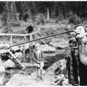 Cover image of [Woman drinking from cup held by hiking stick]