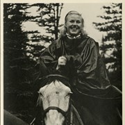Cover image of [Unidentified woman [Ginger Rogers?] on horseback in rain poncho]