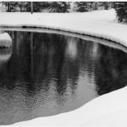 Cover image of Water surrounded by snow