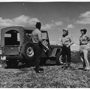 Cover image of Three unidentified people with jeep